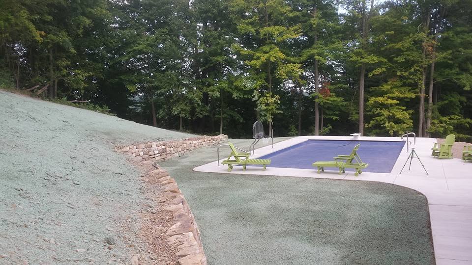Poolside slope green and filled in after hydroseeding